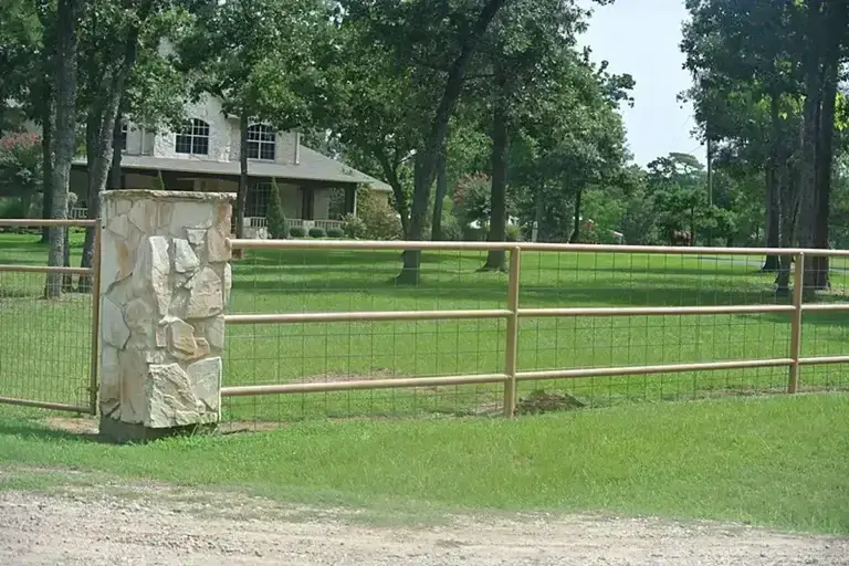 Wood fence installation in progress